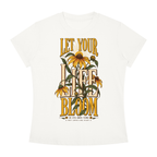 An off-white short-sleeve crewneck t-shirt featuring a large graphic print on the front. The design displays the text 'LET YOUR LIFE BLOOM' in a warm yellow-gold font, overlaid with illustrations of black-eyed Susan flowers in yellow, green, and brown.